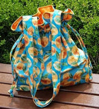 韓国製のオレンジ色の模様の生地(半ヤード単位)