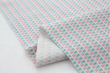 パステルブルーピンクの三角形の模様の生地(韓国製、半ヤード単位)